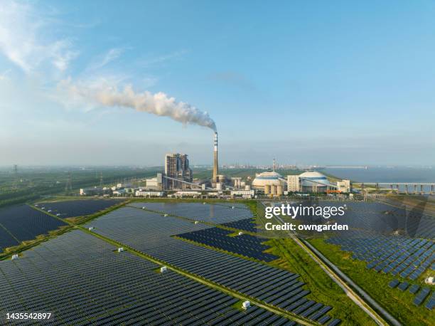 aerial view of thermal power generation and solar power station - växthusgas bildbanksfoton och bilder
