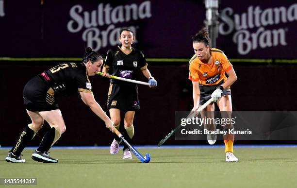 Megan Alakus of Melbourne and Savannah Fitzpatrick of the Blaze challenge for the ball during the round four Hockey One League Women's match between...