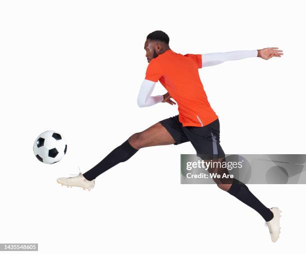 man playing football - treten stock-fotos und bilder