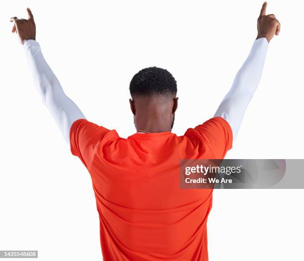 back view of footballer in victory pose - rezar stock pictures, royalty-free photos & images