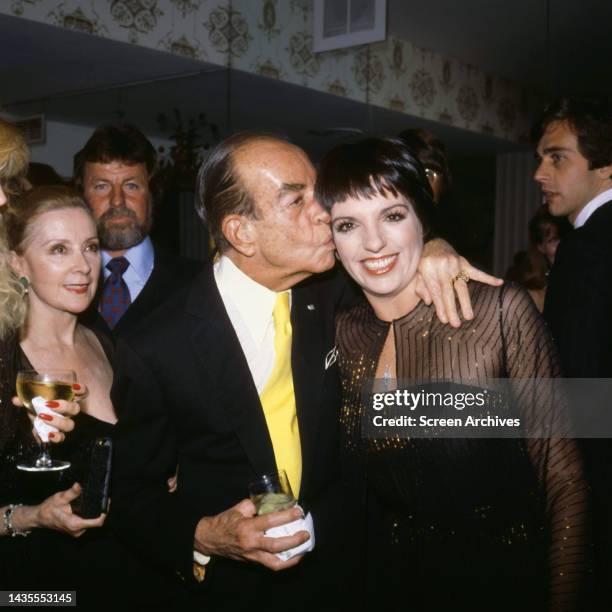 Vincente Minnelli kissing Daughter Liza Minnelli at Hollywood event circa 1973.