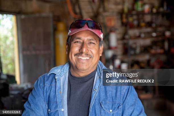 a happy tradesman - tradesman real people man stock pictures, royalty-free photos & images