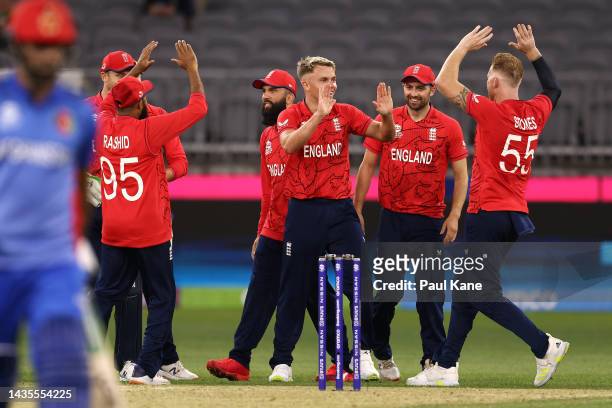 Sam Curran of England celebrates after dismissing Fazalhaq Farooqi of Afghanistan and claiming his 5th wicket during the ICC Men's T20 World Cup...