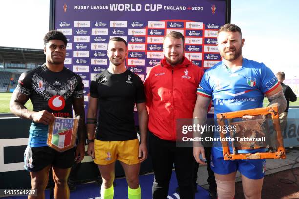 Kevin Naiqama of Fiji and Nathan Brown of Italy take pose after the coin toss with referee Jack Smith and a national lottery winner prior to the...