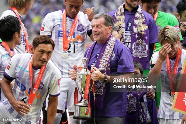 Head coach Michael Skibbe of Sanfrecce Hiroshima celebrates with trophy after during the J.LEAGUE YBC Levain Cup final between Cerezo Osaka and...