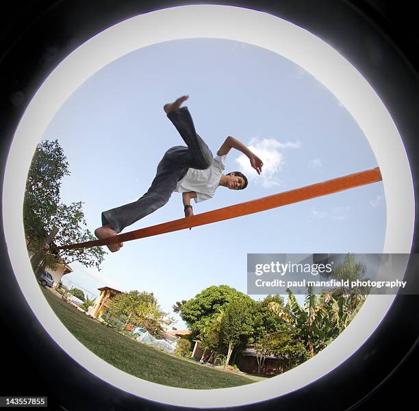 teenager balancing on tight rope - マスキング効果 ストックフォトと画像