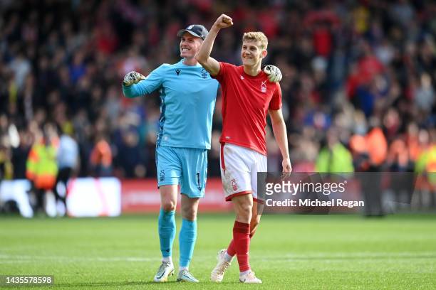 Dean Henderson and Ryan Yates of Nottingham Forest celebrate following the Premier League match between Nottingham Forest and Liverpool FC at City...