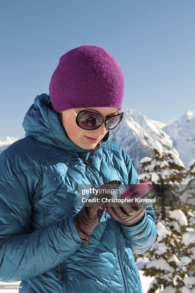 Young woman looking at her phone