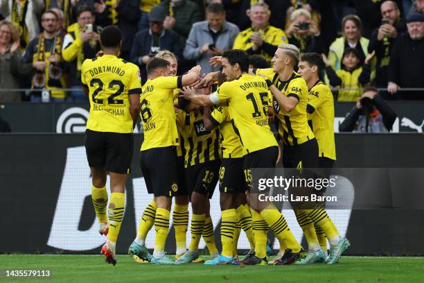 Niklas Sule of Borussia Dortmund celebrates with teammates after scoring their team's second goal during the Bundesliga match between Borussia...