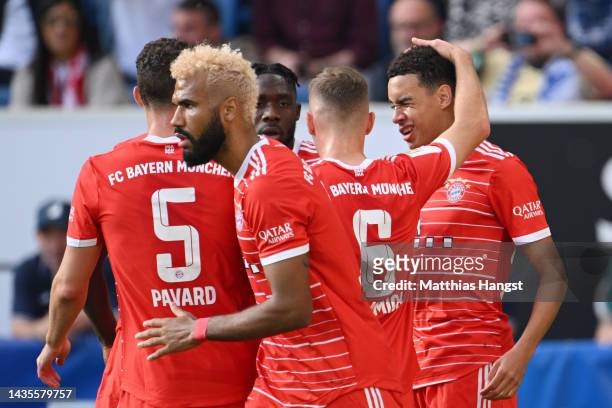 Jamal Musiala of Bayern Munich celebrates with teammates after scoring their team's first goal during the Bundesliga match between TSG Hoffenheim and...