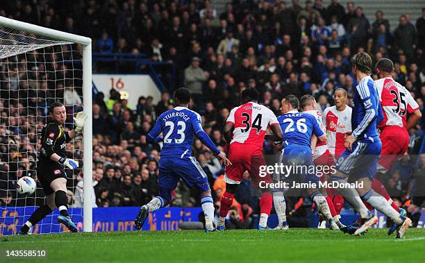 John Terry of Chelsea heads the ball past Paddy Kenny of Queens Park Rangers to score their second goal during the Barclays Premier League match...