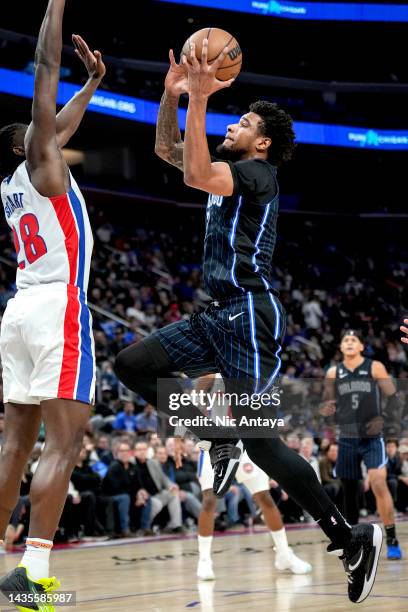 Chuma Okeke of the Orlando Magic shoots the ball against Isaiah Stewart of the Detroit Pistons at Little Caesars Arena on October 19, 2022 in...