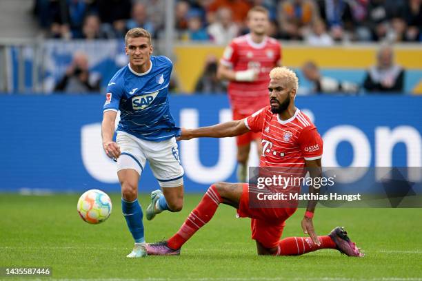 Grischa Proemel of TSG 1899 Hoffenheim is challenged by Eric Maxim Choupo-Moting of Bayern Munich during the Bundesliga match between TSG Hoffenheim...