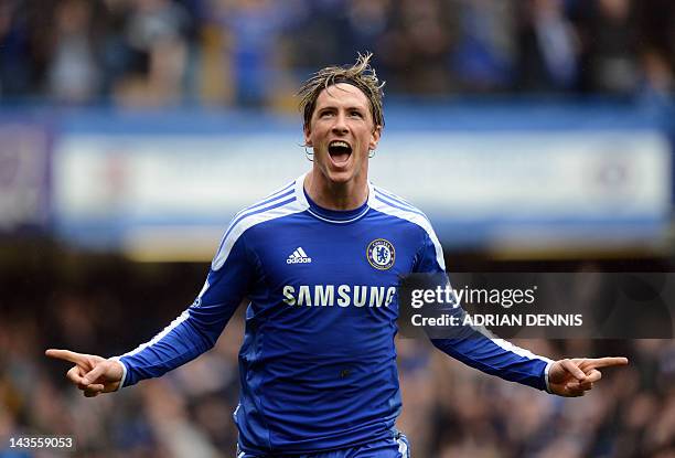 Chelsea's Spanish forward Fernando Torres runs to celebrate after scoring their fourth goal against Queens Park Rangers during the English Premier...