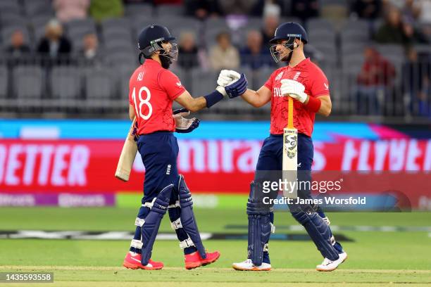 Mooed Ali of England and Liam Livingstone of England congratulate each other for their win during the ICC Men's T20 World Cup match between England...