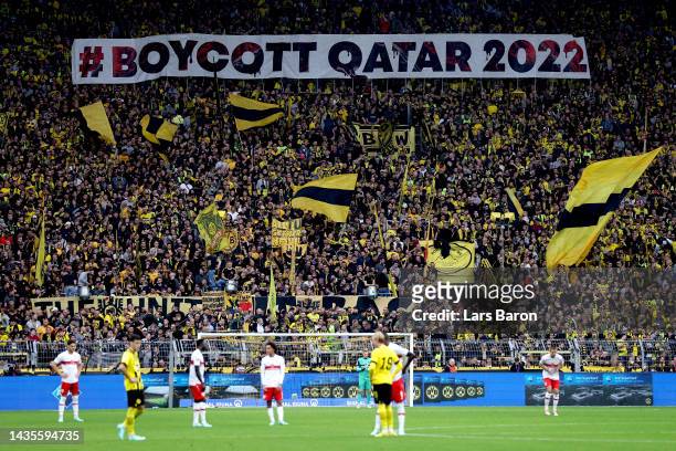 Fans hold a banner reading 'Boycott Qatar 2022' during the Bundesliga match between Borussia Dortmund and VfB Stuttgart at Signal Iduna Park on...