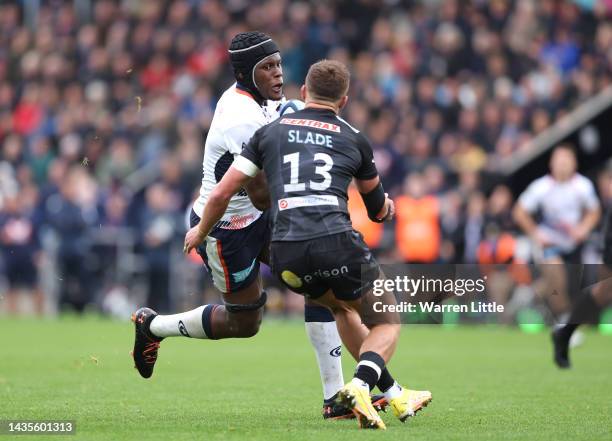 Maro Itoje of Saracens is tackled by Henry Slade of Exeter Chiefs during the Gallagher Premiership Rugby match between Exeter Chiefs and Saracens at...