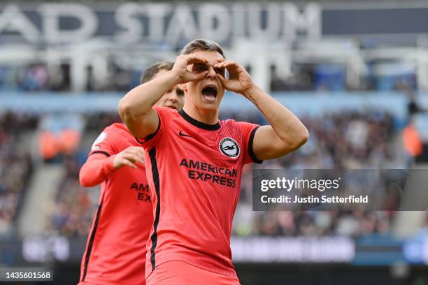 Leandro Trossard of Brighton & Hove Albion celebrates after scoring their team's first goal during the Premier League match between Manchester City...