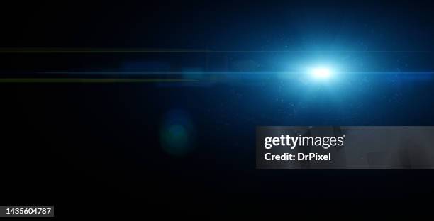 lens flare and glowing particles and copy space - light flare stockfoto's en -beelden