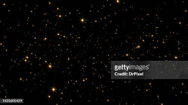 glittering golden particles - confetti gold ストックフォトと画像