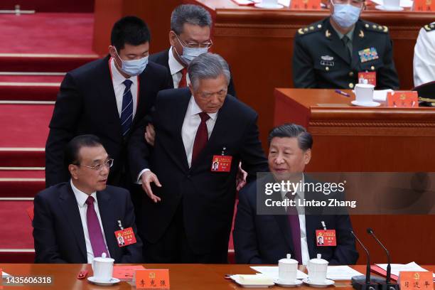 Chinese Premier Li Keqiang, former President Hu Jintao and President Xi Jinping attend the closing ceremony of the 20th National Congress of the...