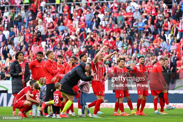 Players of Freiburg celebrate following the Bundesliga match between Sport-Club Freiburg and SV Werder Bremen at Europa-Park Stadion on October 22,...