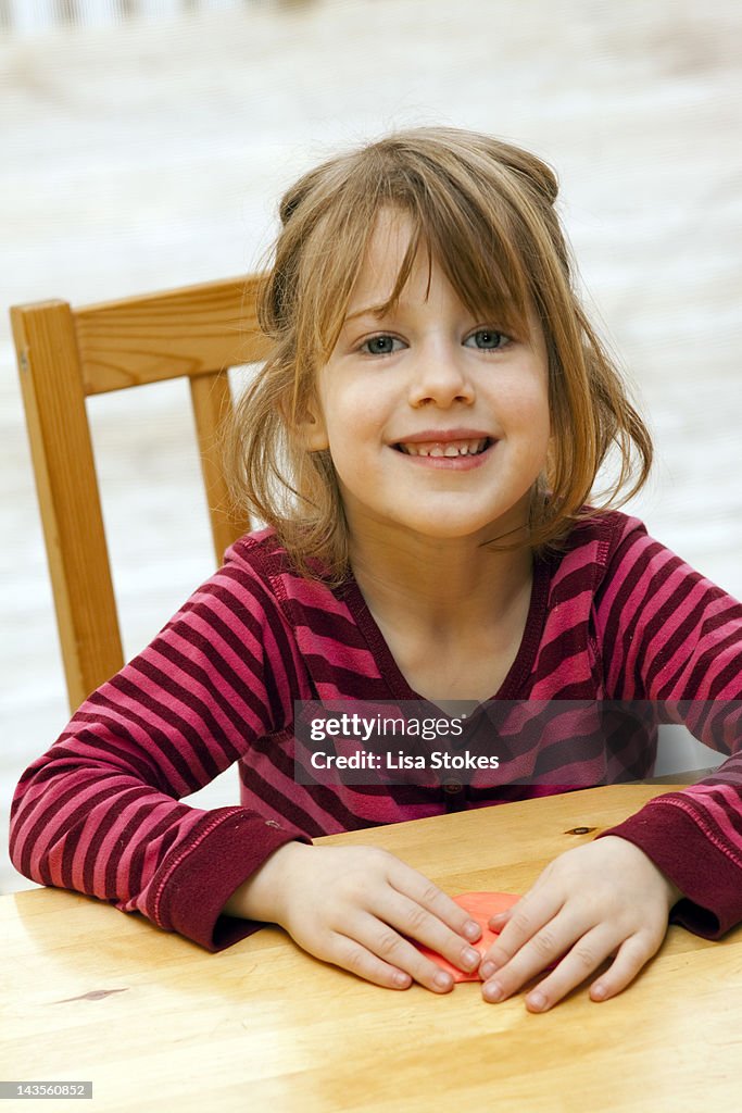 Girl sitting at table