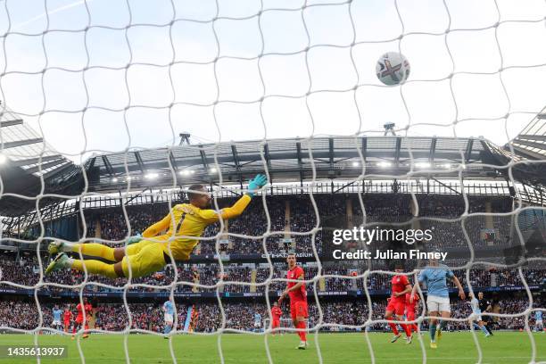 Kevin De Bruyne of Manchester City scores their team's third goal past Robert Sanchez of Brighton & Hove Albion during the Premier League match...