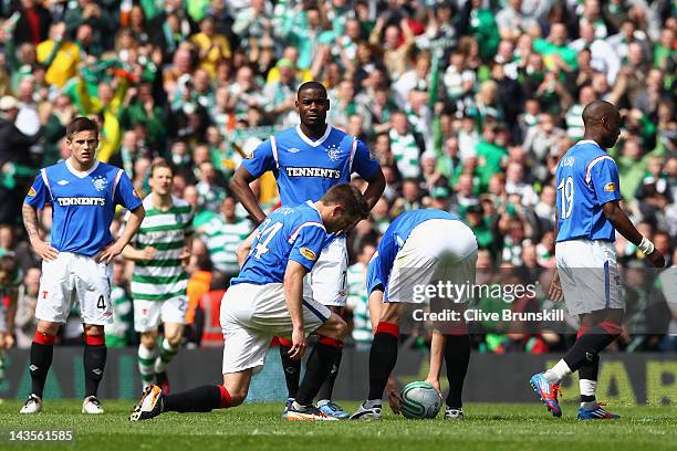 Maurice Edu,Sone Aluko,Lee McCulloch,Andrew Little and Kyle Broadfoot of Rangers show their dejection afterCeltic's third goal during the Clydesdale...