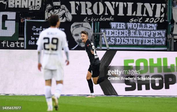 Jesper Lindstrom of Eintracht Frankfurt celebrates after scoring their team's first goal during the Bundesliga match between Borussia Mönchengladbach...