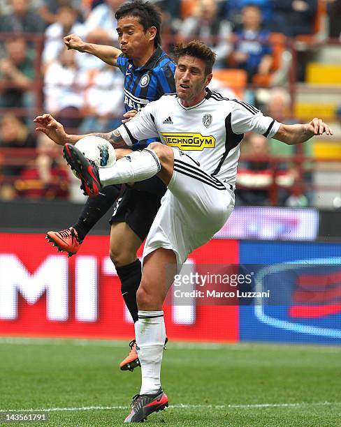 Luca Ceccarelli of AC Cesena competes for the ball with Yuto Nagatomo of FC Internazionale Milano during the Serie A match between FC Internazionale...