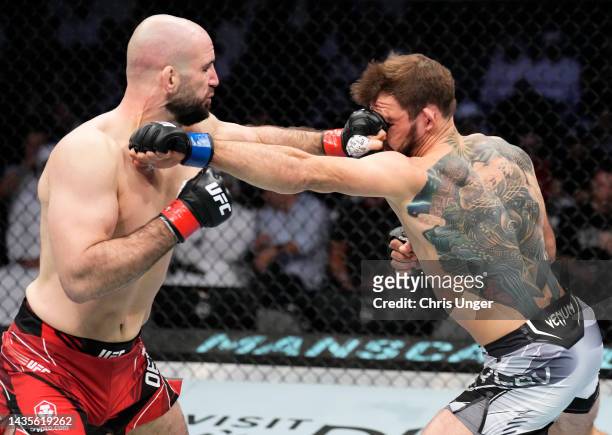 Volkan Oezdemir of Switzerland punches Nikita Krylov of Ukraine in a light heavyweight fight during the UFC 280 event at Etihad Arena on October 22,...