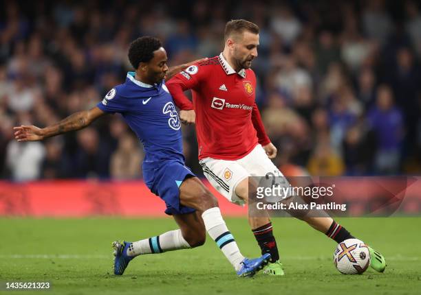 Luke Shaw of Manchester United battles for possession with Raheem Sterling of Chelsea during the Premier League match between Chelsea FC and...