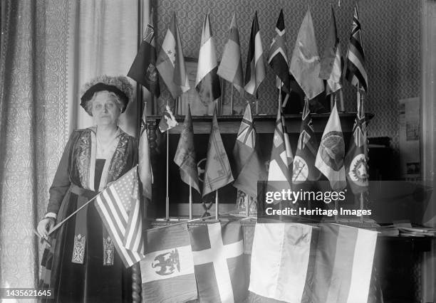 Mrs. Carrie Chapman Catt with Flags of 22 Nations, 1917. American women's suffrage campaigner, president of the National American Woman Suffrage...