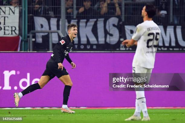 Jesper Lindstrom of Eintracht Frankfurt celebrates after scoring their team's third goal during the Bundesliga match between Borussia Mönchengladbach...