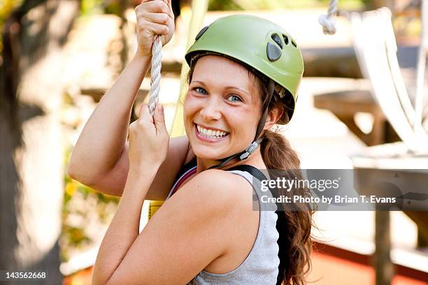 woman on zipline ropes course - zip line stock pictures, royalty-free photos & images