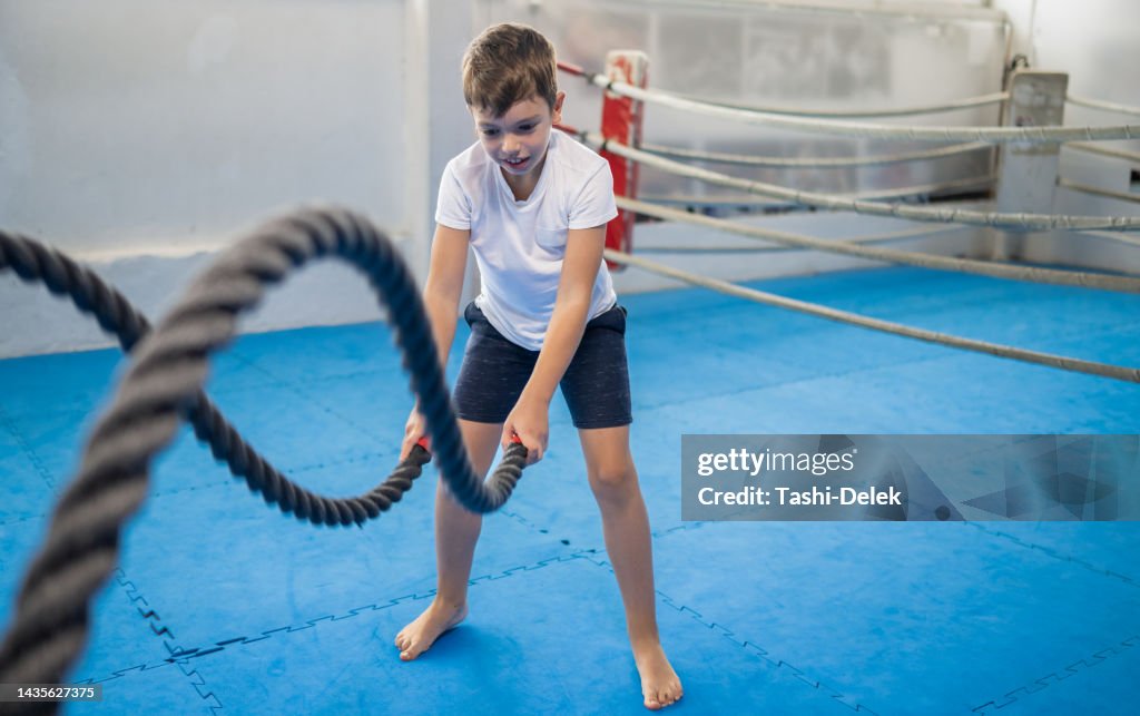Battle Rope For Kids A Small Boy Training With Battle Rope High-Res Stock Photo - Getty Images