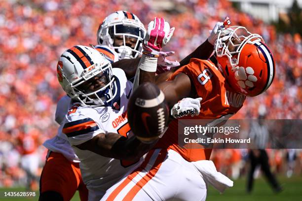 Darian Chestnut and Alijah Clark of the Syracuse Orange break up a pass intended for Adam Randall of the Clemson Tigers in the second quarter at...