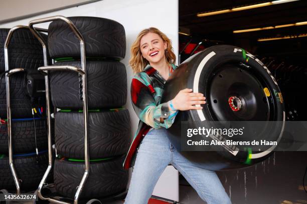Chloe Grace Moretz poses for a photo with a wheel outside Williams Racing during the Formula 1 United States Grand Prix at Circuit of The Americas on...