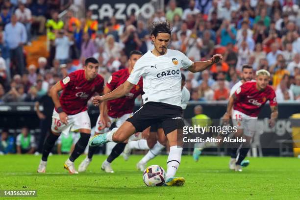 Edinson Cavani of Valencia scores their team's first goal from the penalty spot during the LaLiga Santander match between Valencia CF and RCD...