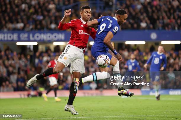 Casemiro of Manchester United battles for possession with Pierre-Emerick Aubameyang of Chelsea during the Premier League match between Chelsea FC and...