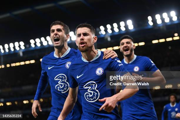 Jorginho of Chelsea celebrates with teammate Christian Pulisic after scoring their team's first goal during the Premier League match between Chelsea...