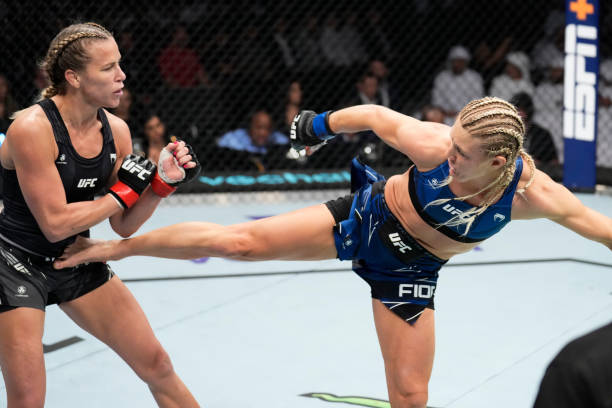 Manon Fiorot of France kicks Katlyn Chookagian in a flyweight fight during the UFC 280 event at Etihad Arena on October 22, 2022 in Abu Dhabi, United...