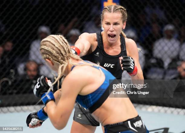 Katlyn Chookagian punches Manon Fiorot of France in a flyweight fight during the UFC 280 event at Etihad Arena on October 22, 2022 in Abu Dhabi,...