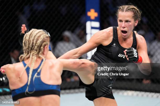 Katlyn Chookagian kicks Manon Fiorot of France in a flyweight fight during the UFC 280 event at Etihad Arena on October 22, 2022 in Abu Dhabi, United...
