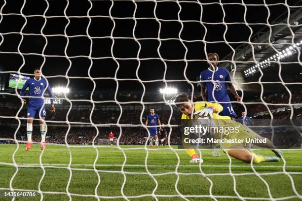 Kepa Arrizabalaga of Chelsea dives for the ball but fails to save as Casemiro of Manchester United scores their team's first goal during the Premier...