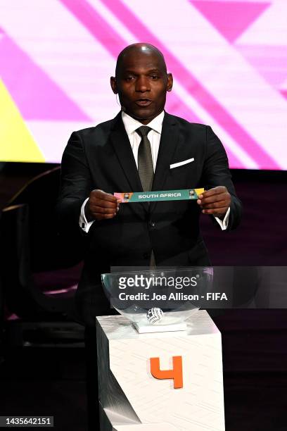 Draw Assistant Geremi Njitap draws out South Africa during the FIFA Women's World Cup 2023 Final Tournament Draw at Aotea Centre on October 22, 2022...
