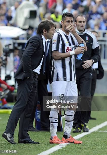 Juventus FC head coach Antonio Conte and Marco Borriello during the Serie A match between Novara Calcio and Juventus FC at Silvio Piola Stadium on...