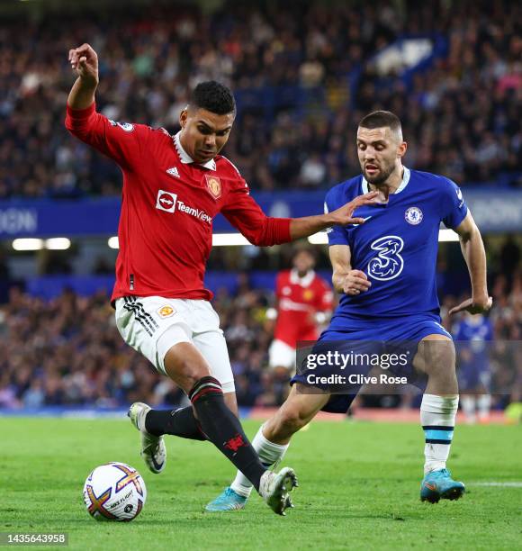 Mateo Kovacic of Chelsea battles for possession with Casemiro of Manchester United during the Premier League match between Chelsea FC and Manchester...