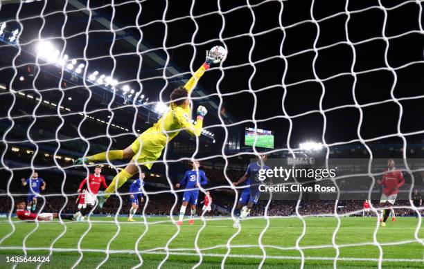 Kepa Arrizabalaga of Chelsea dives for the ball but fails to save as Casemiro of Manchester United scores their team's first goal during the Premier...